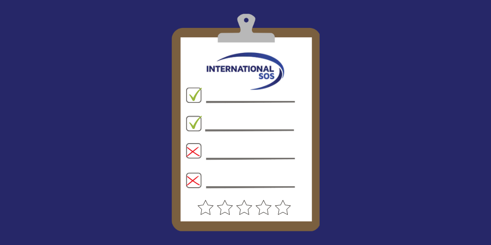The International SOS insurance logo on a review clipboard