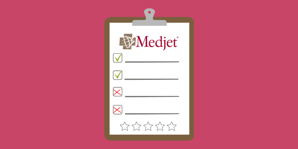 The Medjet insurance logo on a review clipboard.